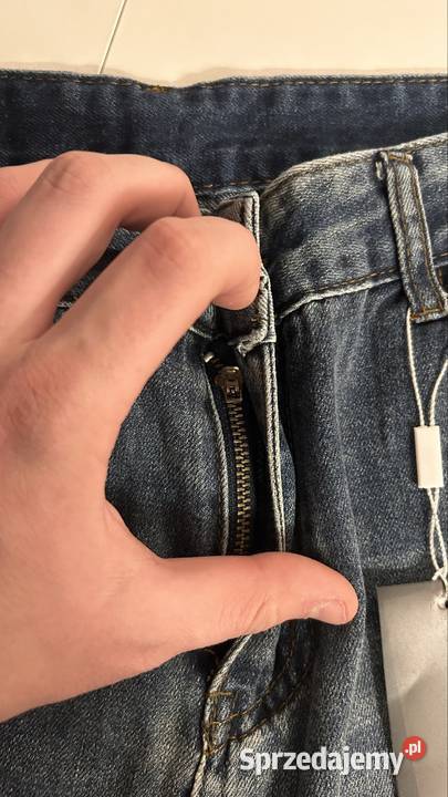 Spodnie jeansowe z przetarciami męskieunisex Odzież damska
