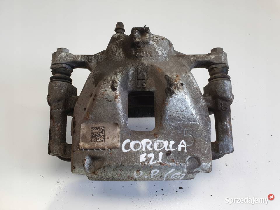Toyota Corolla XII E21 PRZEDNI ZACISK HAMULCOWY Rudka