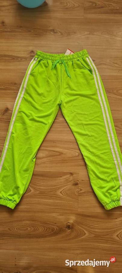 Spodnie dresowe damskie neonowy zielony Cięcina