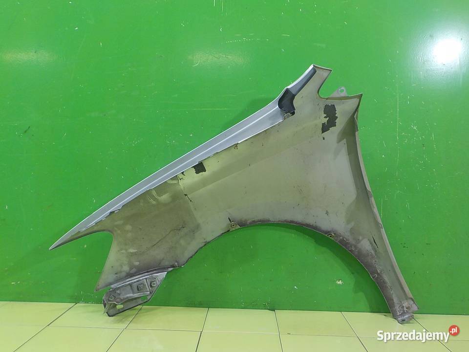 VW POLO V 6R 12 B 10r 5D blotnik prawy przod Suków