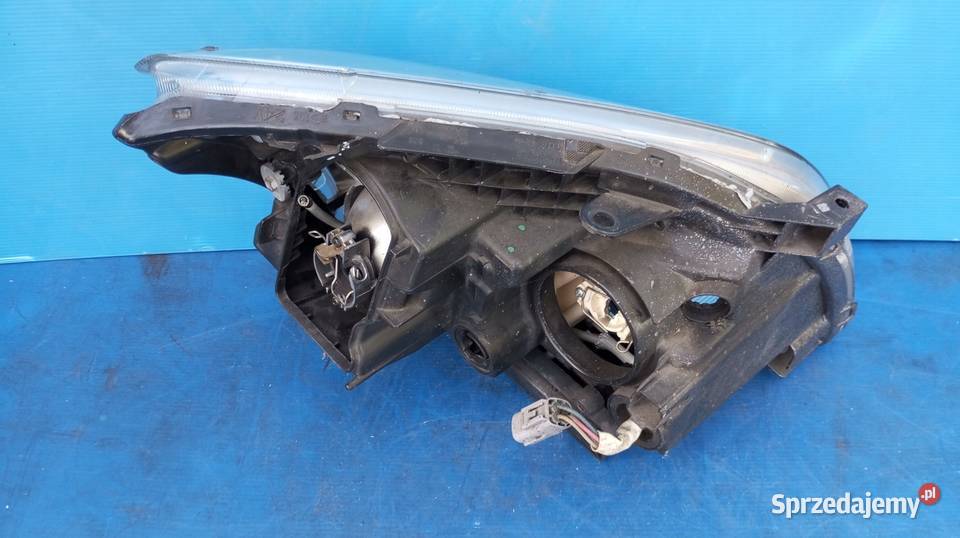 LAMPA REFLEKTOR LEWY PRZÓD EU TOYOTA AVENSIS T25 osobowe Lampy przednie Nowy Tomyśl