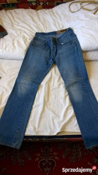 Męskie jeansy jasne z przetarciami Rozmiar M