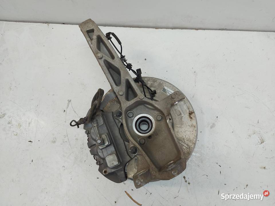 TESLA MODEL Y 2022r ZWROTNICA PIASTA LEWY PRZÓD Piasty i łożyska kół