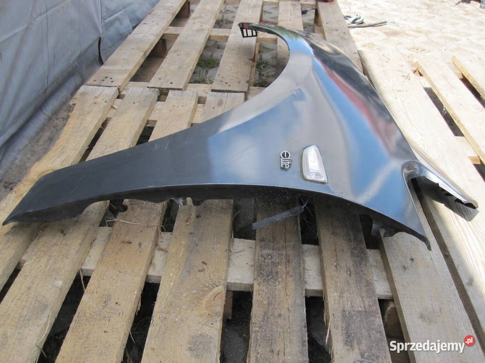 OPEL ASTRA J IV 11r błotnik lewy przód