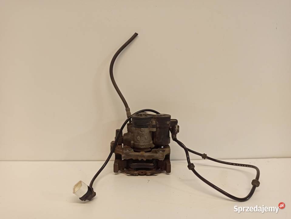 MERCEDES W205 ZACISK LEWY TYŁ A2054231998 Układ hamulcowy