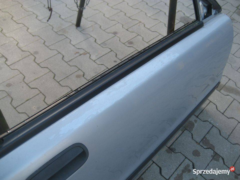 volvo s40 v40 9600r drzwi przód prawe srebne kod Rakoniewice