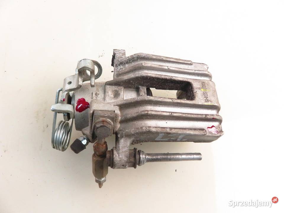 ZACISK LEWY TYŁ SEAT TOLEDO II 1M2 18 20V 125