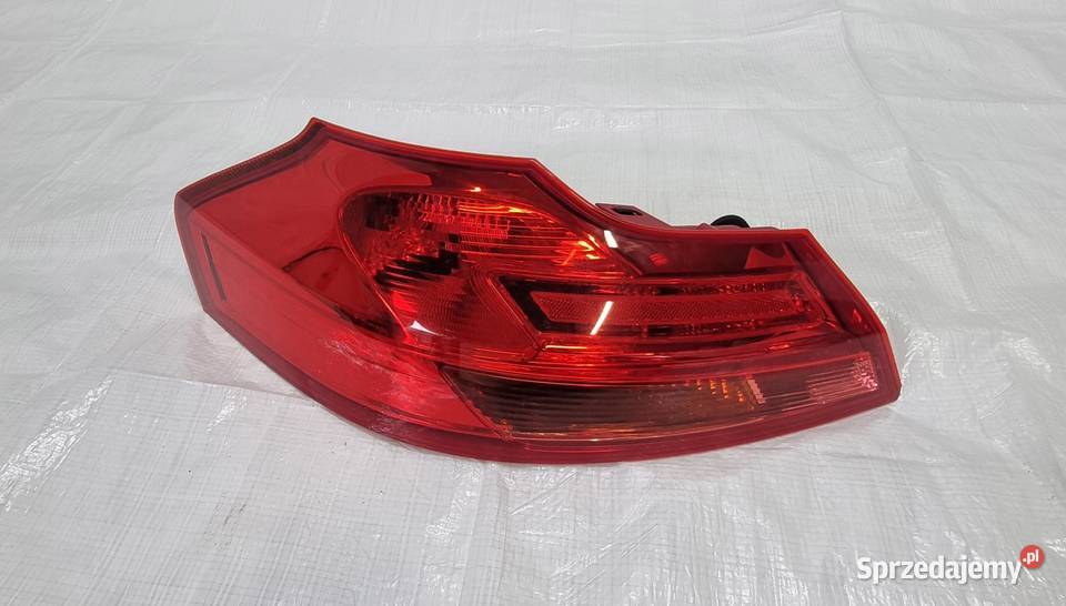 OPEL INSIGNIA A KOMBI 22950973 LAMPA TYŁ LEWA osobowe Lampy przednie