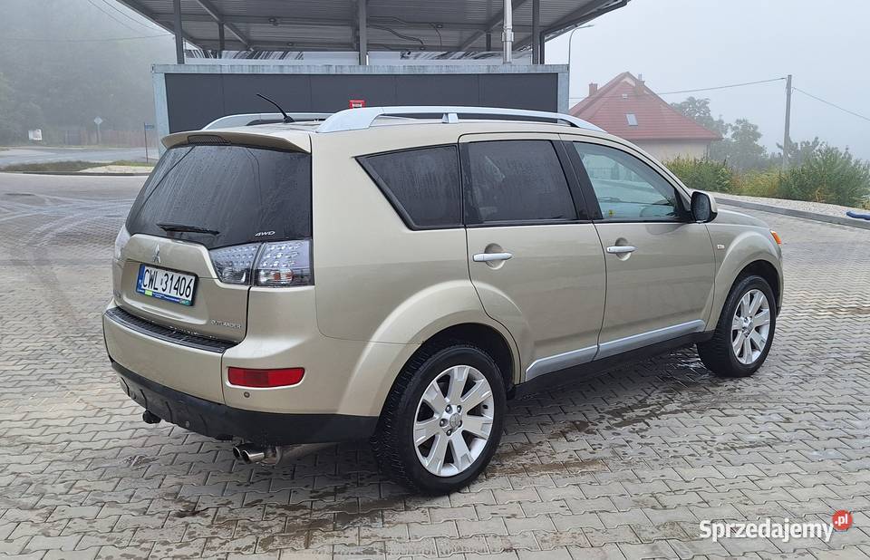 Mitsubishi Outlander II 20 DID 164 7 osobowy relingi dachowe Wieniec