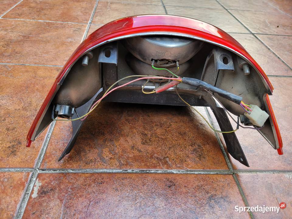 DERBI ATLANTIS lampa tyl tylnia blotnik komplet Lampy tylne