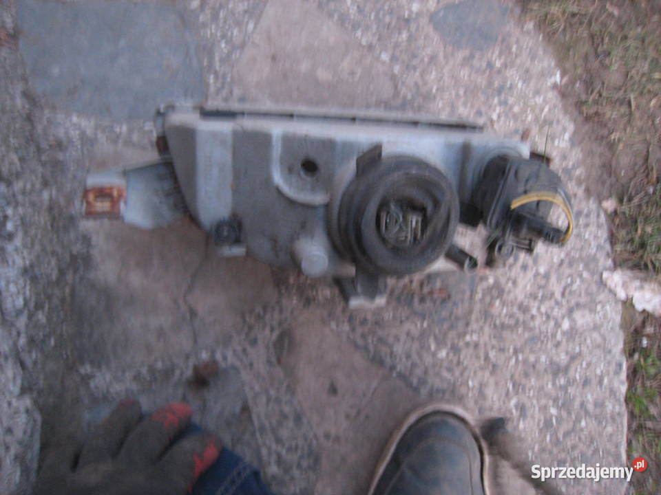 Lampa przednia lewa H4 Fiat Punto I 9399