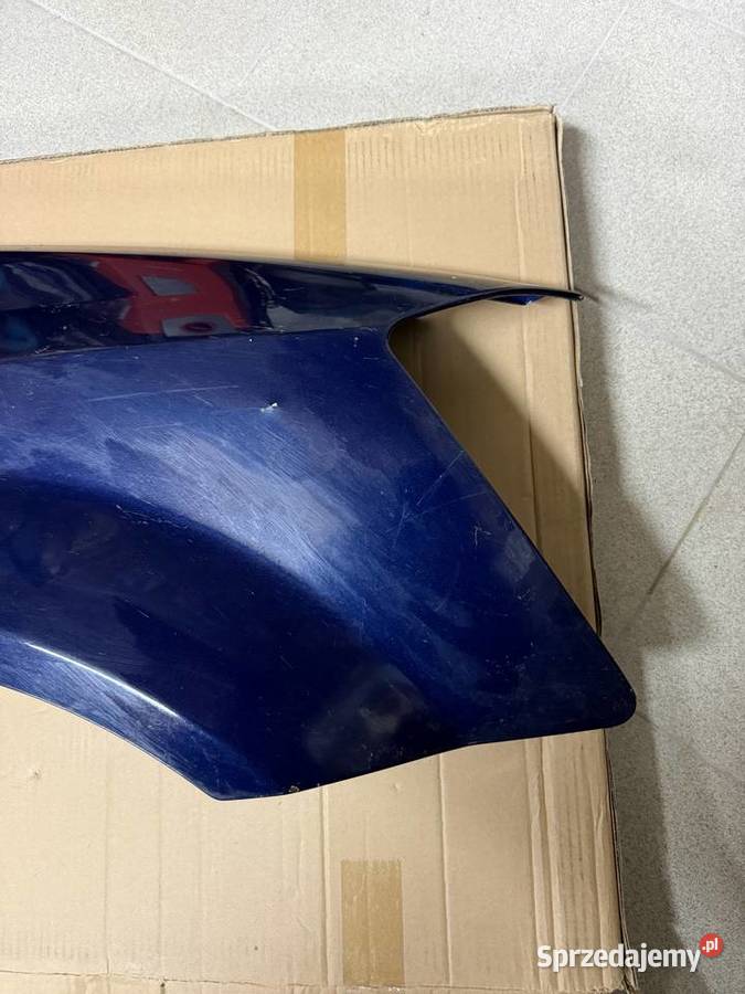 Błotnik prawy przód Dodge Grand Caravan oryginał osobowe