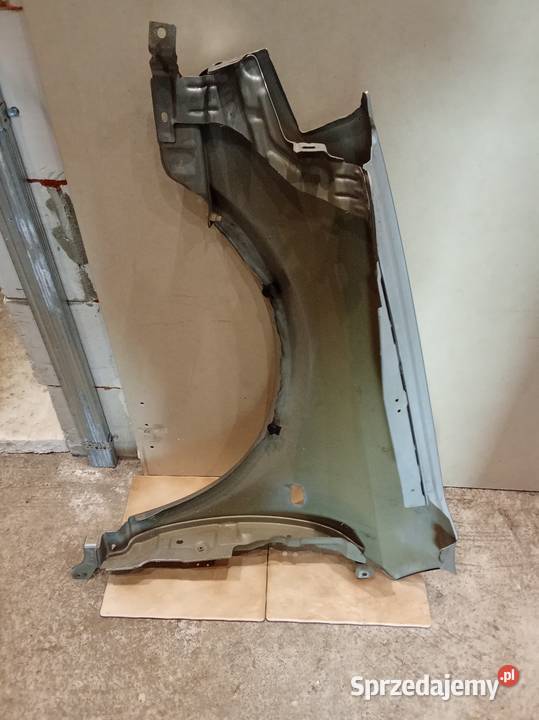 Nissan Primera P12błotnik prawy orginał osobowe