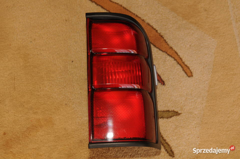 Patrol Y61 lampa OEM oryginał osobowe