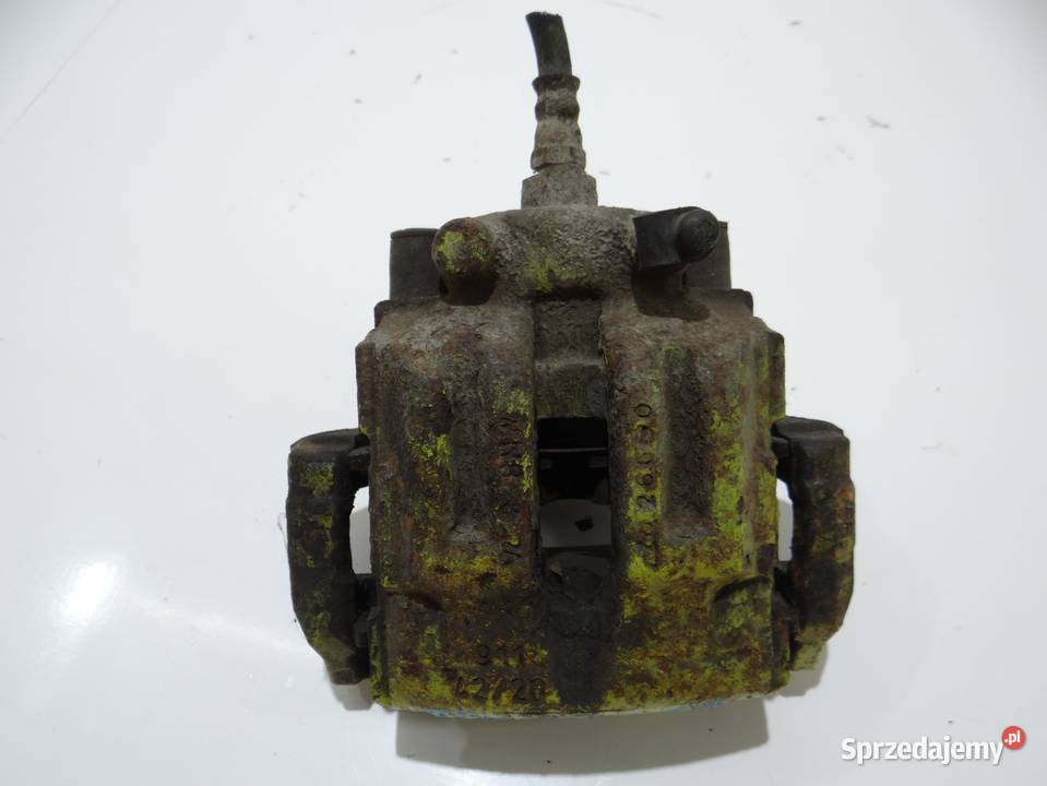 ZACISK HAMULCOWY LEWY TYŁ BMW E90 E91 N52 4220