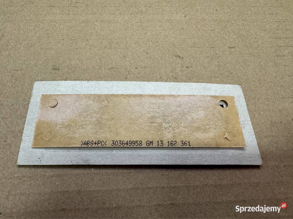 Znaczek napis Logo Opel GM 13162361 303649958 Międzychód