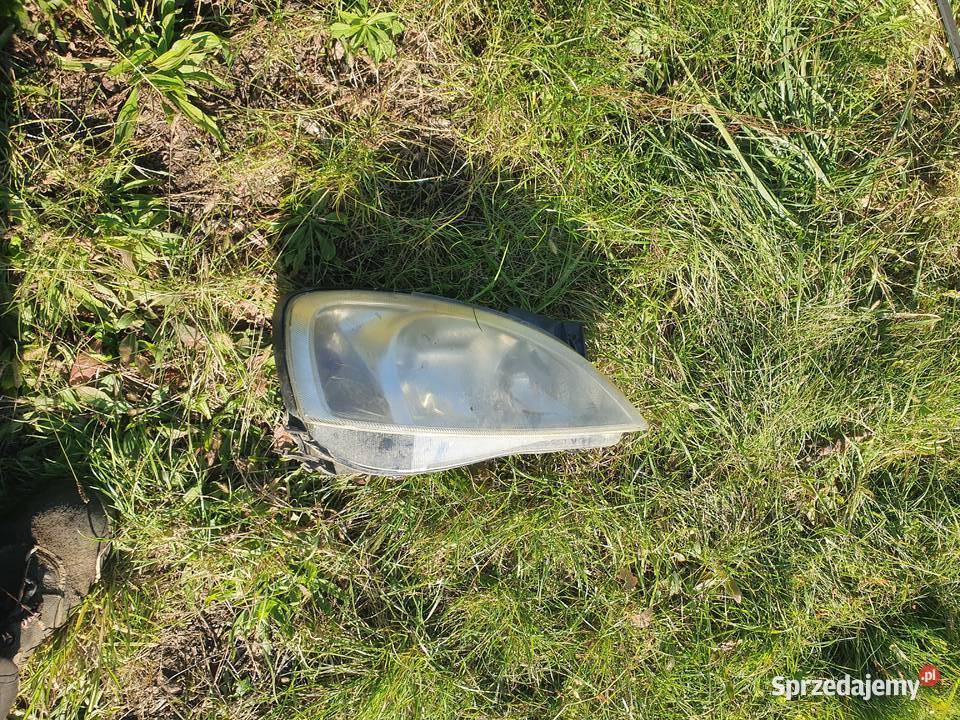 Lampa przednia reflektor Opel Corsa C 0004