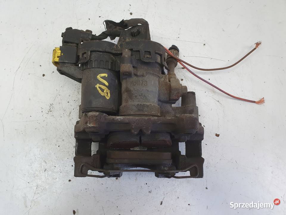 Volvo V60 II TYLNY ZACISK HAMULCOWY lewy tył Janów