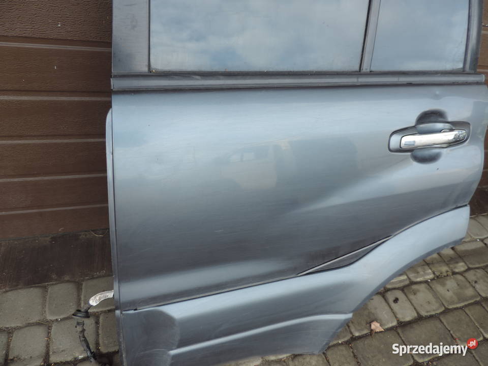 SUZUKI GRAND VITARA 1 5D DRZWI LEWY TYŁ ZY4C13 małopolskie Nowy Sącz