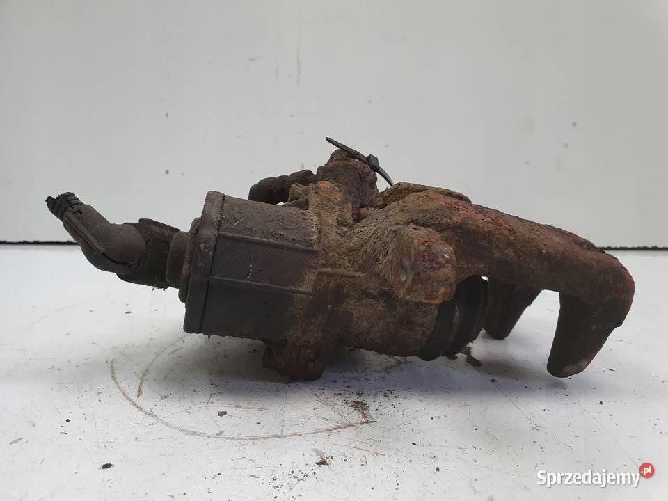 VW Passat B6 TYLNY ZACISK HAMULCOWY lewy tył