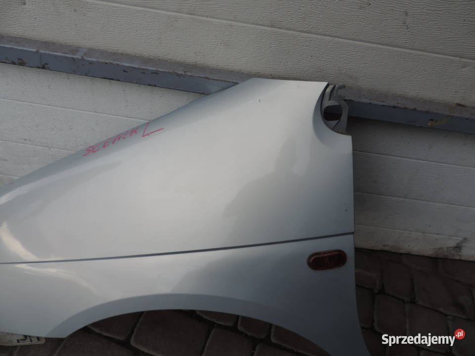 BŁOTNIK LEWY PRZEDNI RENAULT SCENIC 1 FL MV632 Części samochodowe Nowy Sącz