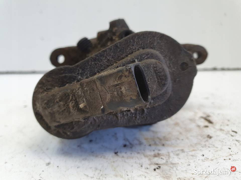 VW Passat B6 TYLNY ZACISK HAMULCOWY lewy tył