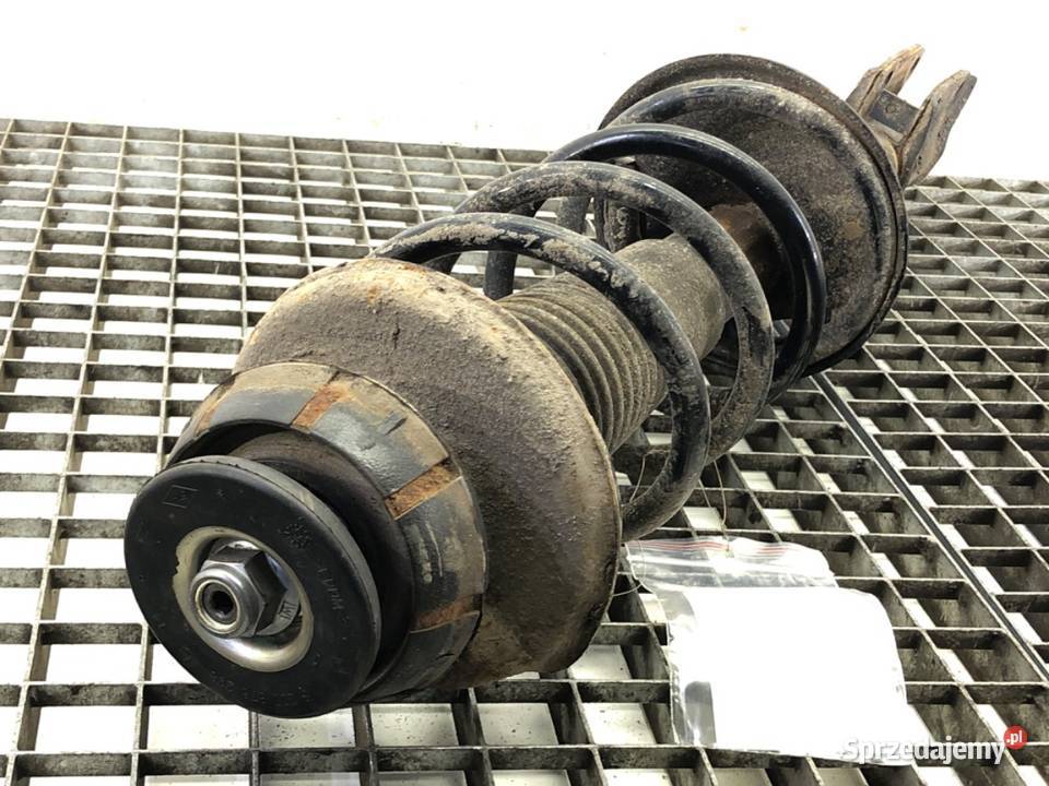 AMORTYZATOR LEWY PRZÓD ZE SPRĘŻYNĄ DACIA DUSTER