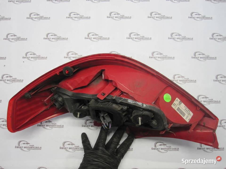 OPEL CORSA D lampa lewa tył 13211840 89038962A