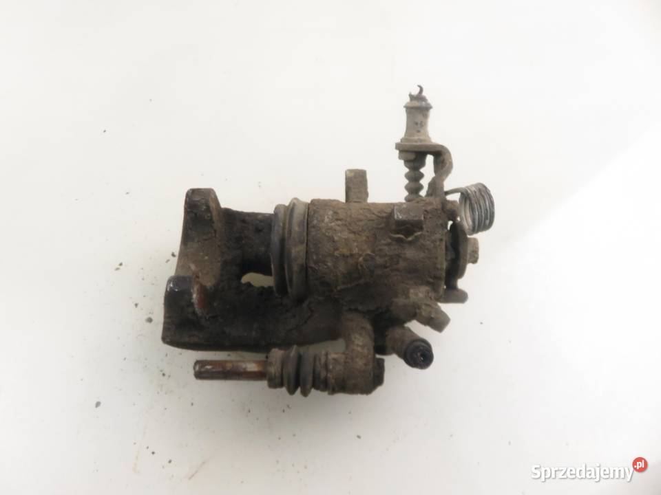 ZACISK LEWY TYŁ OPEL COMBO C 13 CDTI 16V Z 13