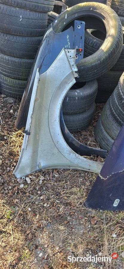 Błotnik Lewy Opel Astra H Srebrny ładny stan Żabno