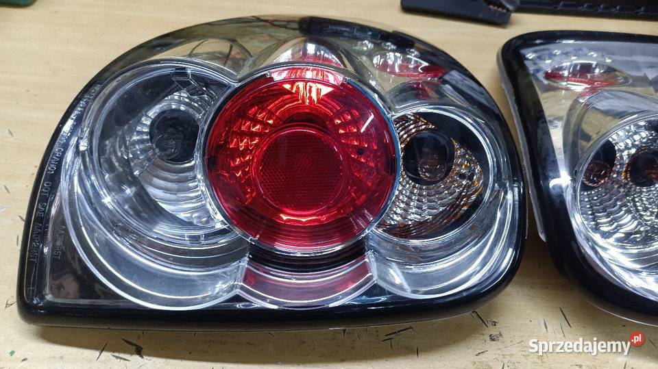 Lampy tył nowe Chrysler Voyager 0107 Dodge Grand