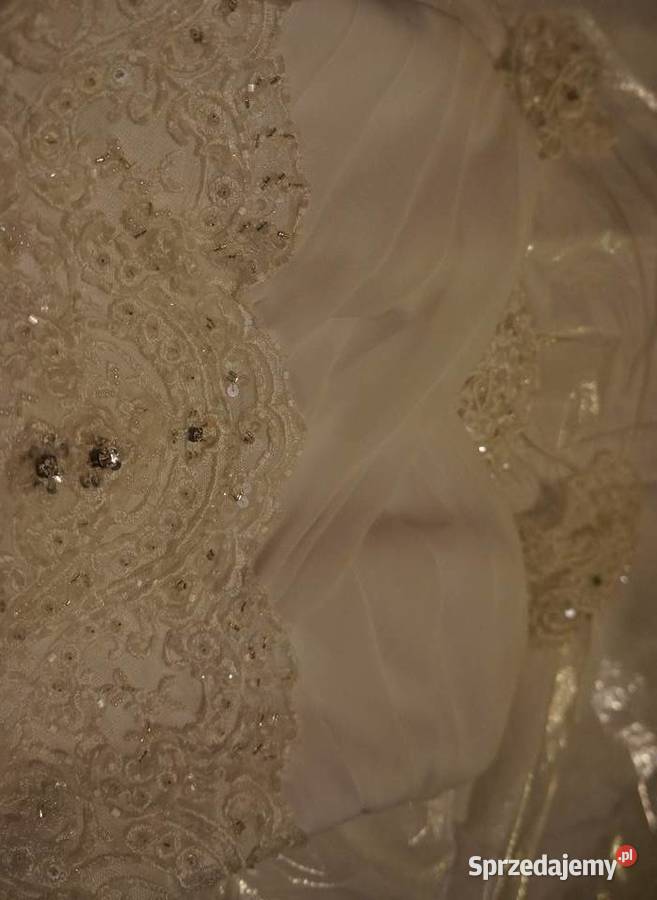 Ślubna biała suknia z koronką Kraków