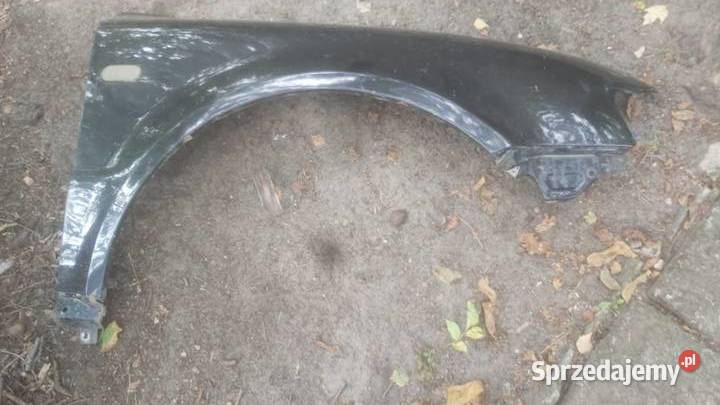 Blotnik przód prawy VOLKSWAGEN PASSAT B5 czarny Karoseria Margonin