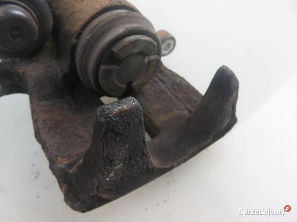 ZACISK LEWY TYŁ VW PASSAT B7 20 TDI