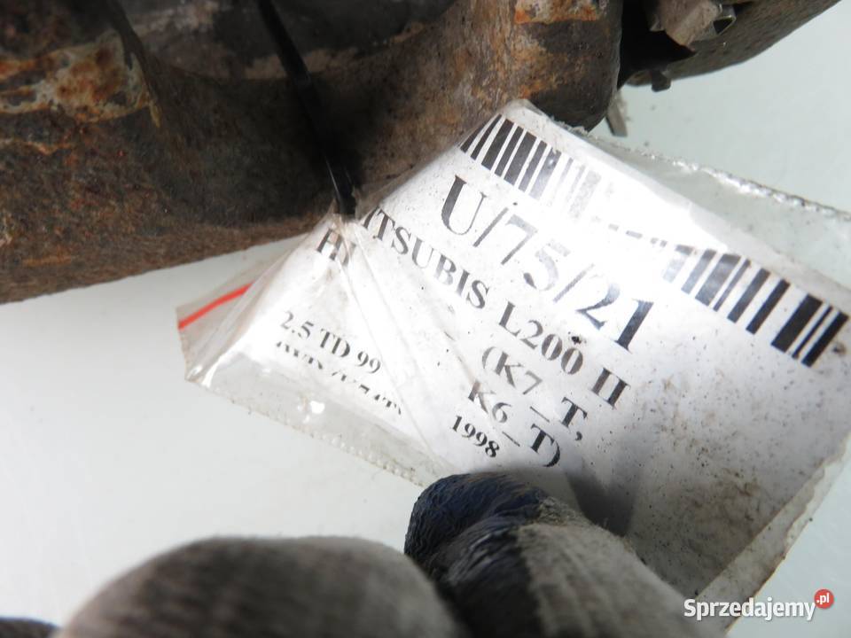 ZACISK LEWY PRZÓD MITSUBISHI L200 II 25 TD