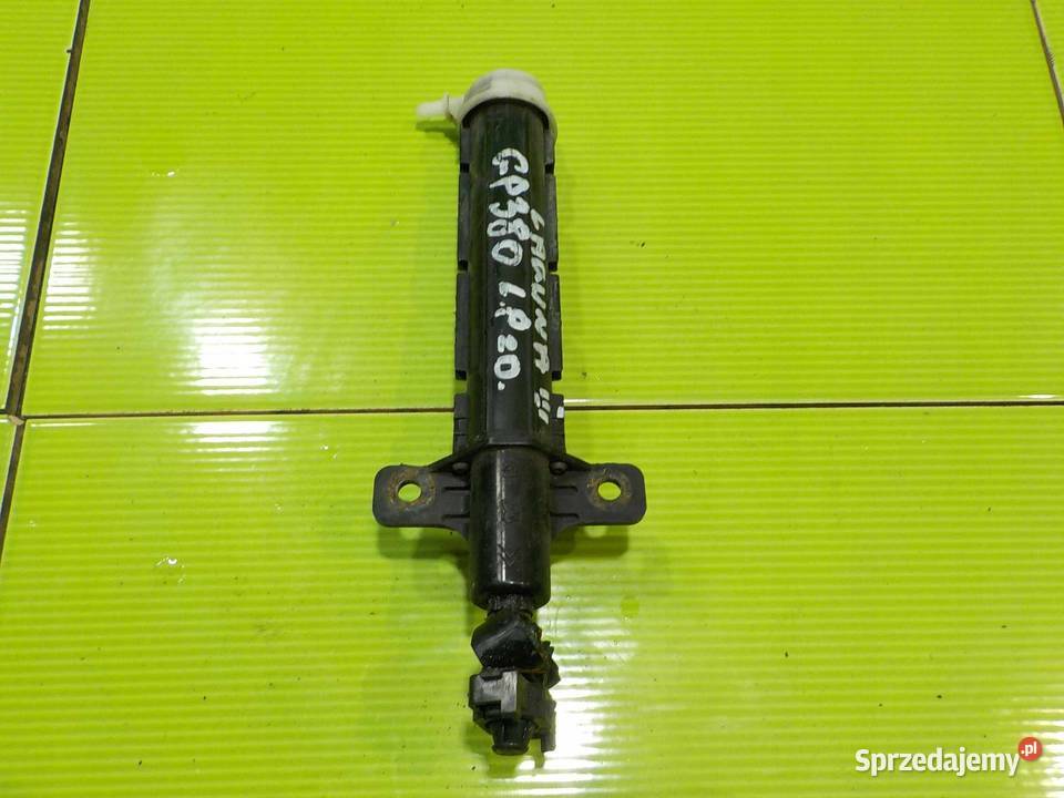 RENAULT LAGUNA III 10r spryskiwacz lampy lewy osobowe Suków