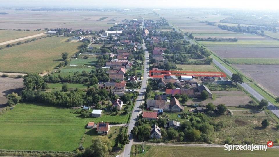Działka budowlanousługowa z domem do remontu w Sprzedaż Małujowice