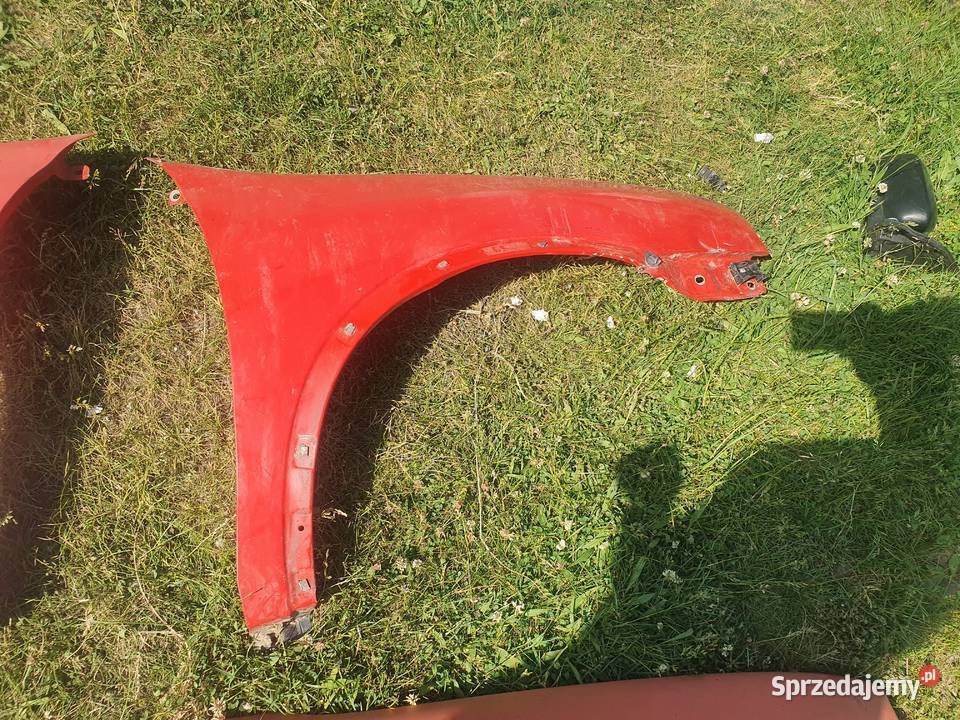 Błotnik prawy przedni przód czerwony Opel Corsa Kraków
