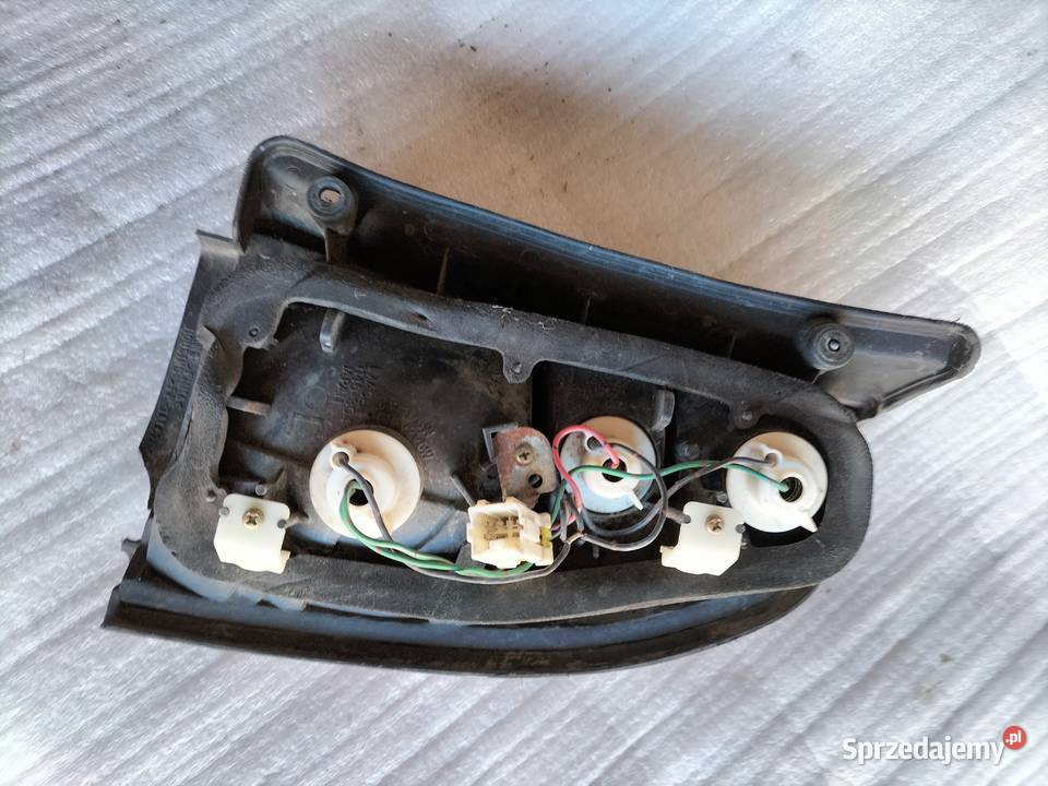 MITSUBISHI LANCER V LAMPA TYLNA LEWA 1146304 Oświetlenie Kamień-Kolonia