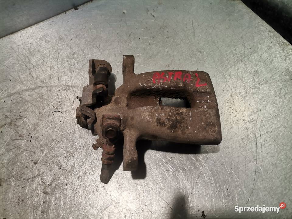 ZACISK HAMULCOWY LEWY TYŁ OPEL ASTRA III H 19