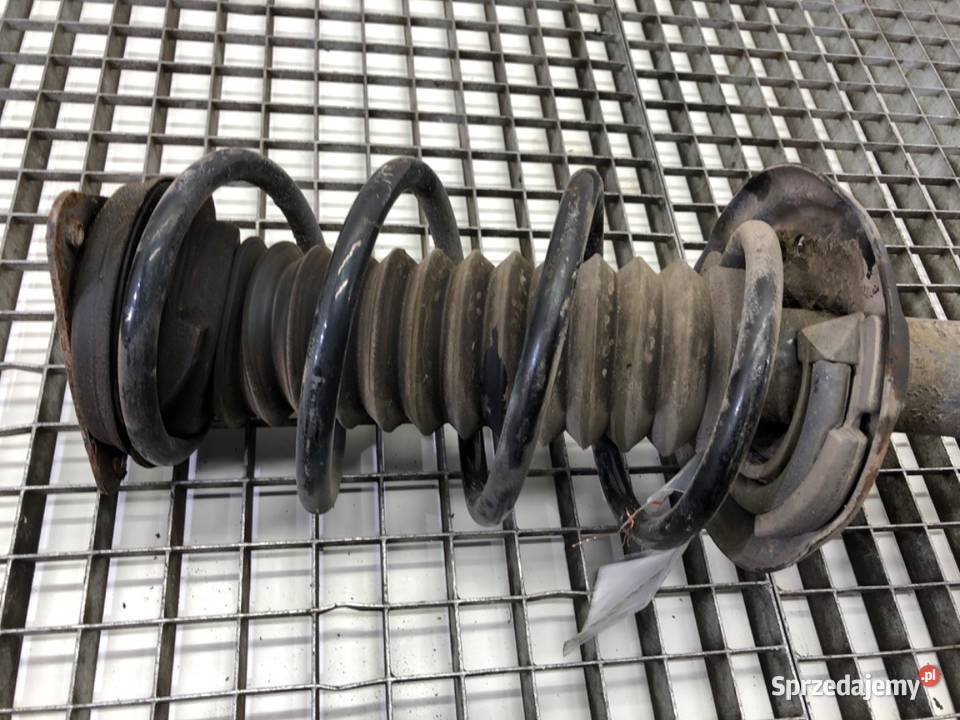 AMORTYZATOR LEWY PRZÓD ZE SPRĘŻYNĄ NISSAN