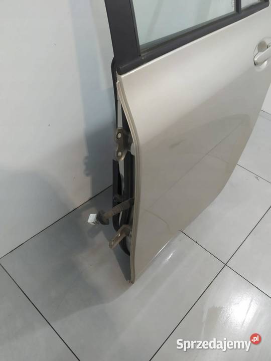 DRZWI LEWE TYŁ 5A7 Toyota Yaris II 20052011 Motoryzacja
