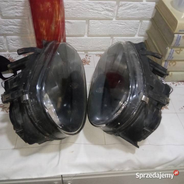 Lampy przód hella VW golf 4 czarne Motoryzacja