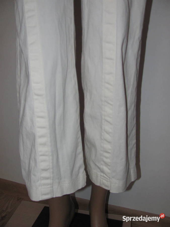 Kombinezon bez rękawów dzwony kremowe spodnie lubelskie Zamość