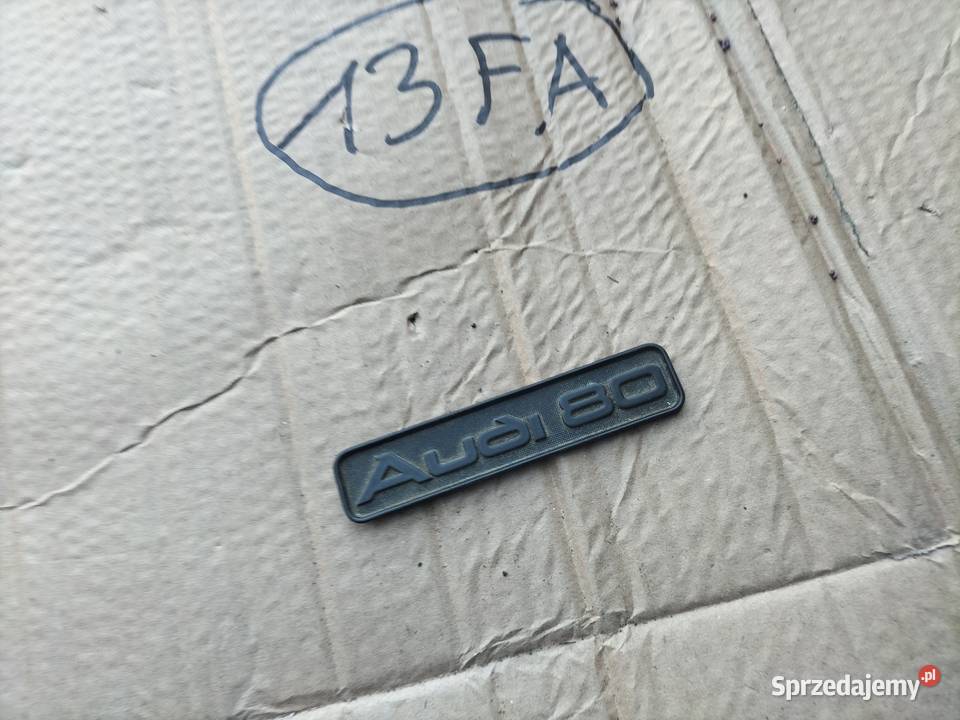 ZNACZEK EMBLEMAT NAPIS KONSOLI DESKI AUDI 80 B3 Pozostałe Wyposażenie wnętrza Kamień-Kolonia sprzedam