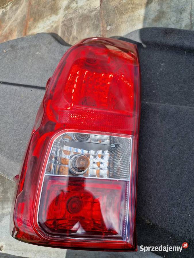 Toyota HILUX VIII lampa tył lewa nowa ORG EU osobowe podkarpackie Mielec