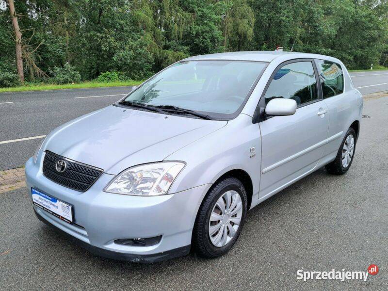 COROLLA E12 błotnik prawy przód srebrny bez