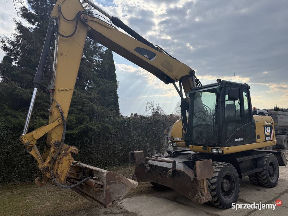 Sprzedam koparkę kołową Cat 313 D sprzedam