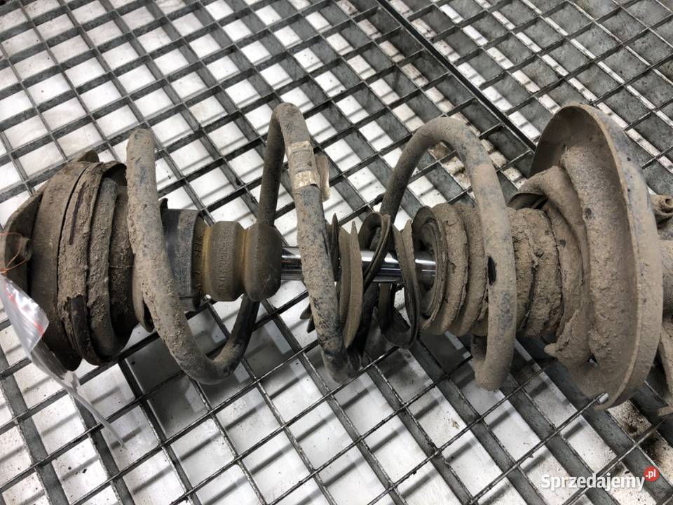 AMORTYZATOR LEWY PRZÓD ZE SPRĘŻYNĄ RENAULT CLIO