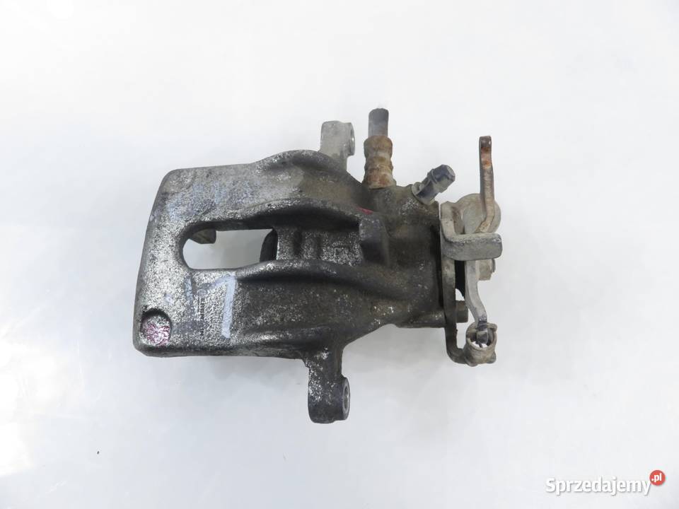 ZACISK LEWY TYŁ FORD FOCUS MK1 I 18 TDDi